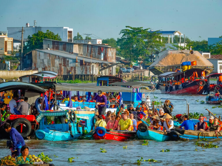 Colourful boats gathered at a floating market in the Mekong Delta, Vietnam