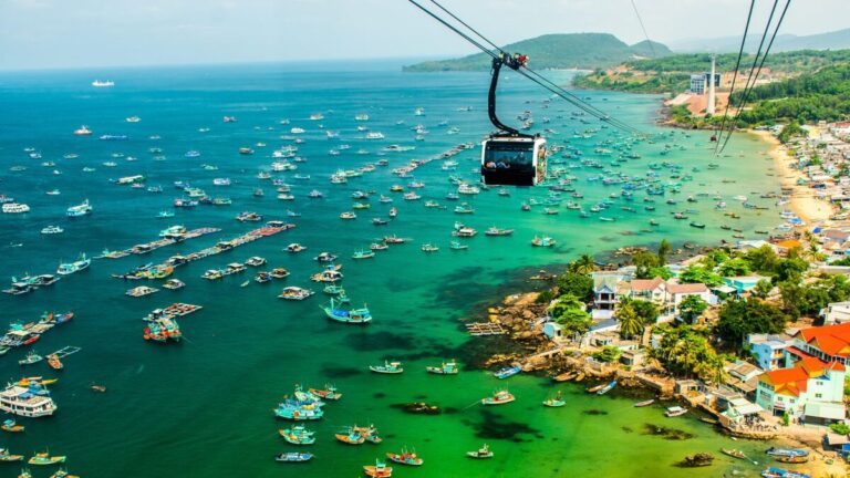 Cable car above coastal waters and boats in Phu Quoc, Vietnam